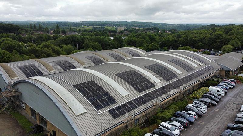 Solar panels on the curved roof of a David Lloyd leisure centre